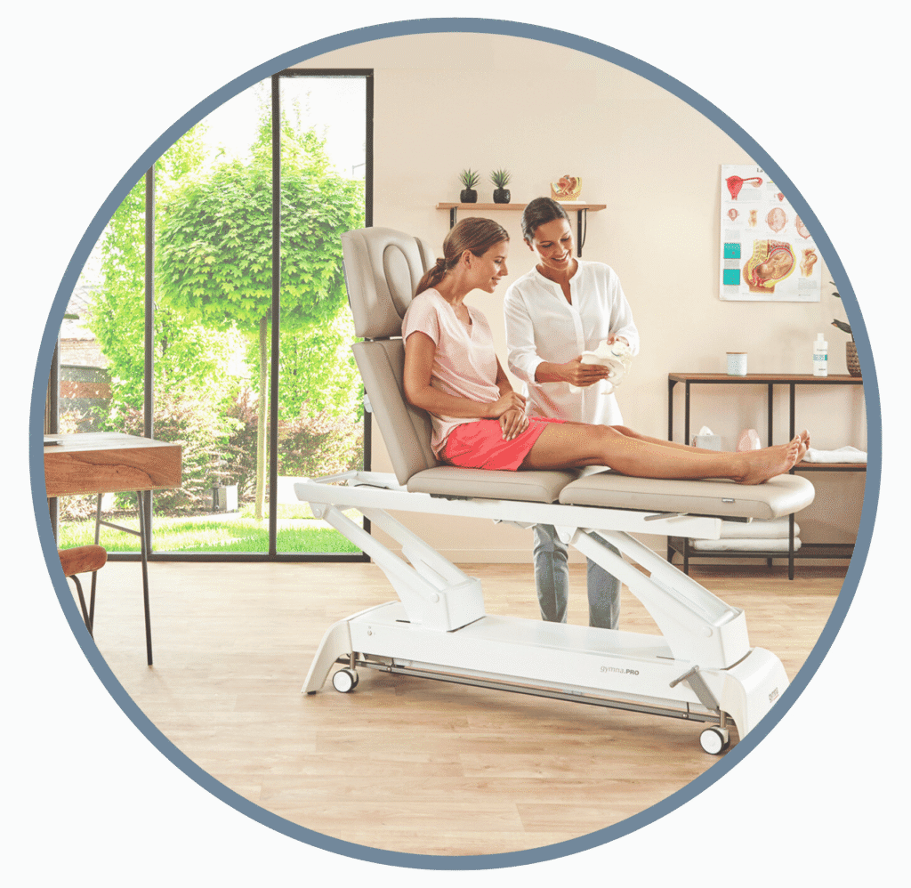 Patient on a treatment table being treated by a physiotherapist